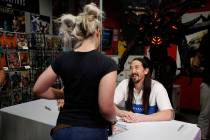 Steve Aoki talks to a fan during a comic book signing of his new "Neon Future" comic ...