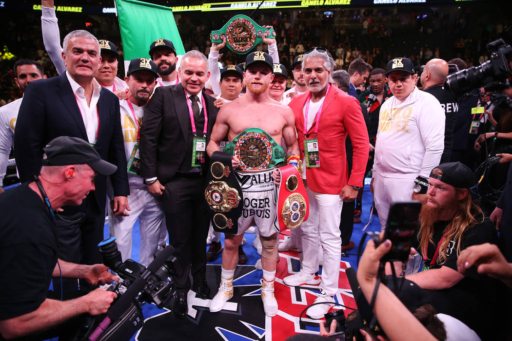 Saul “Canelo” Alvarez, celebrates his win against Daniel Jacobs in the WBC, WBA, ...