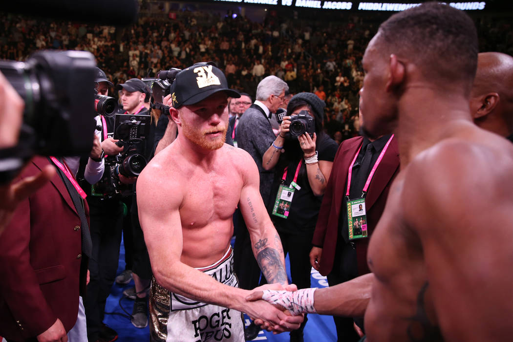 Saul “Canelo” Alvarez, left, shakes hands with Daniel Jacobs after their fight in ...