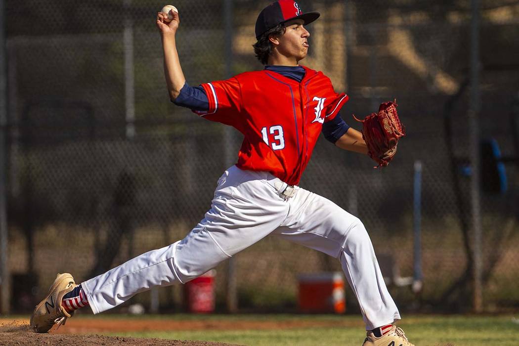 Liberty pitcher Devin Contreras (13) sends another throw towards the plate versus Spring Valley ...