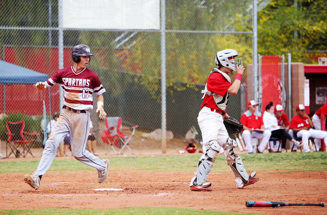 Cimarron-Memorial's Ethan Daniel (17) make home base in the second round playoff game in the Mo ...