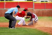 Arbor View's Garrett Cutting (7) tags out Cimarron-Memorial's Jackson Folkman (6) in the second ...