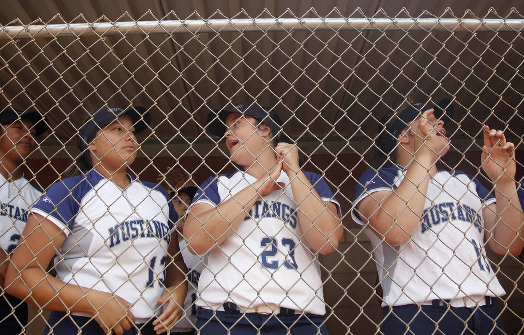 Shadow Ridge High School players Mikayla Brown (13), Alexis Toia (23), and Tori Nichols (16) ch ...