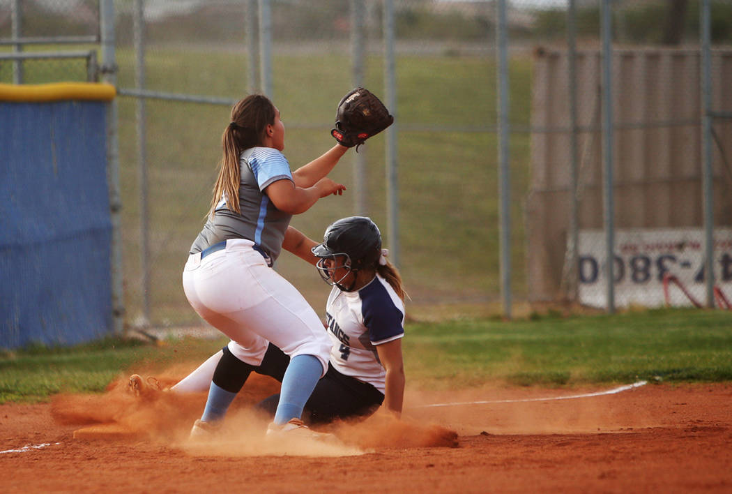 Centennial High School's Sofia Ruelas (10) fails to tag out Shadow Ridge High School's Shea Cle ...