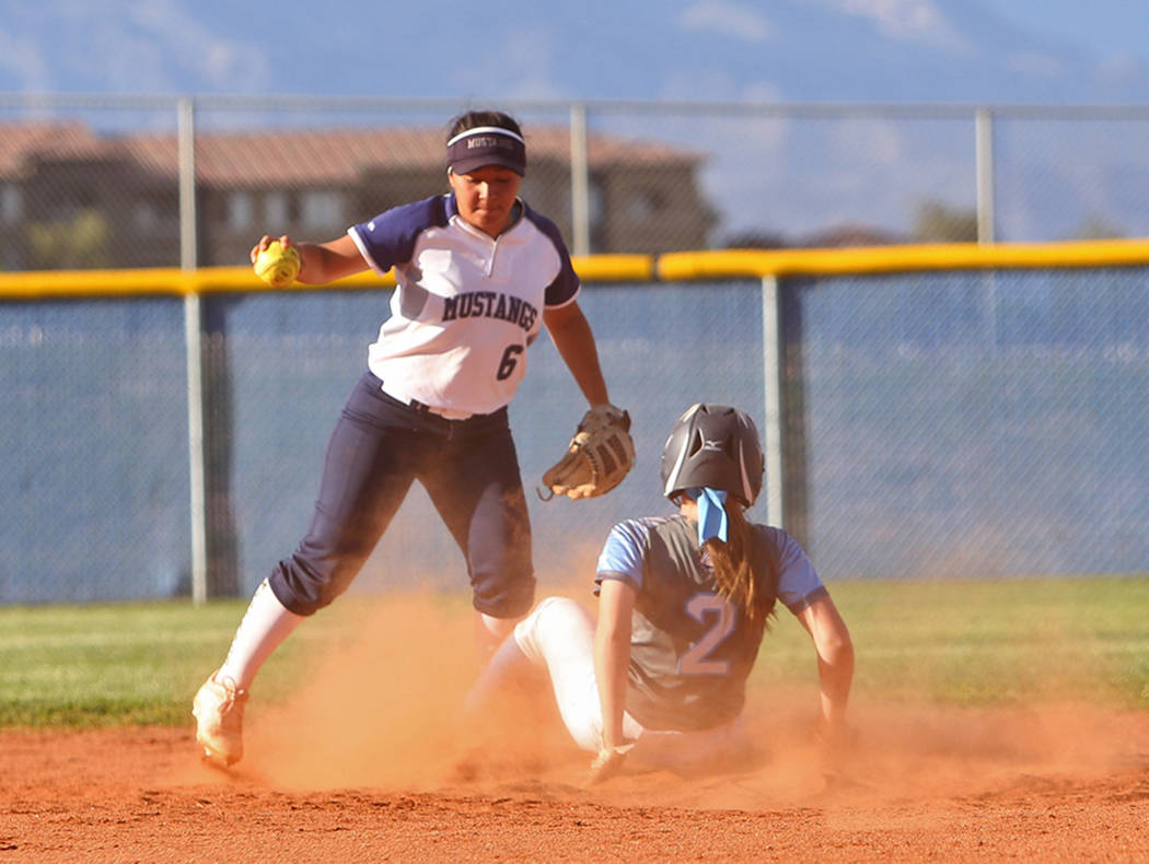 Shadow Ridge High School's Angelina Esqueda (6) attempts to tag out Centennial High School's Ry ...