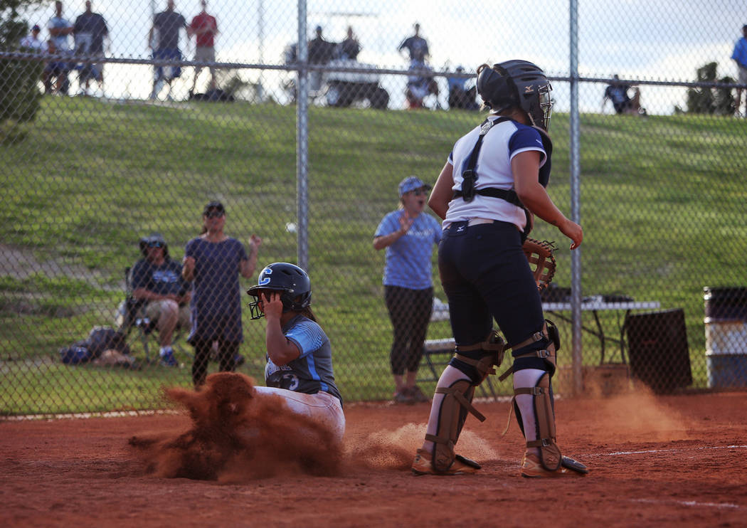 Centennial High School's Natasha Lawrence (3) makes a home run right after another teammate, ev ...