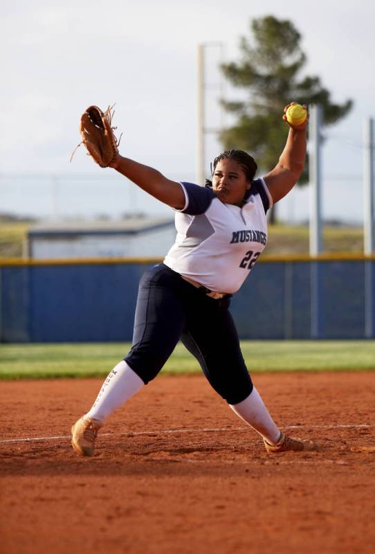 Shadow Ridge High School's Alexia Toia (23) winds the pitch against Centennial High School in t ...