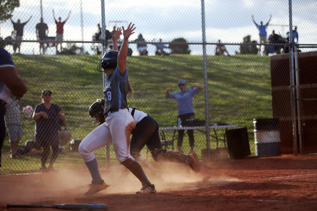 Centennial High School's Ashlynn Heck (8) makes a home run, winning the game 3-2 against Shadow ...