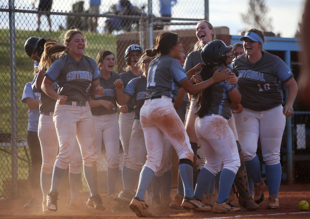 Centennial High School players cheer after winning 3-2 against Shadow Ridge High School in the ...