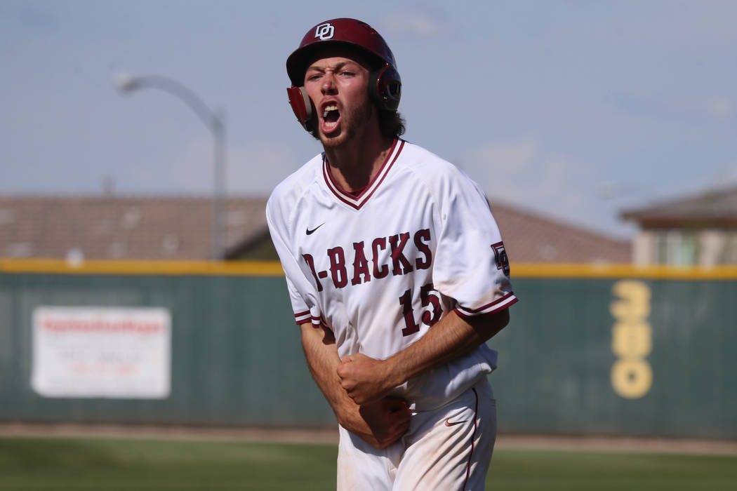 Desert Oasis' Campbell Holt (15) reacts after a single hit against Basic in the Desert Region c ...