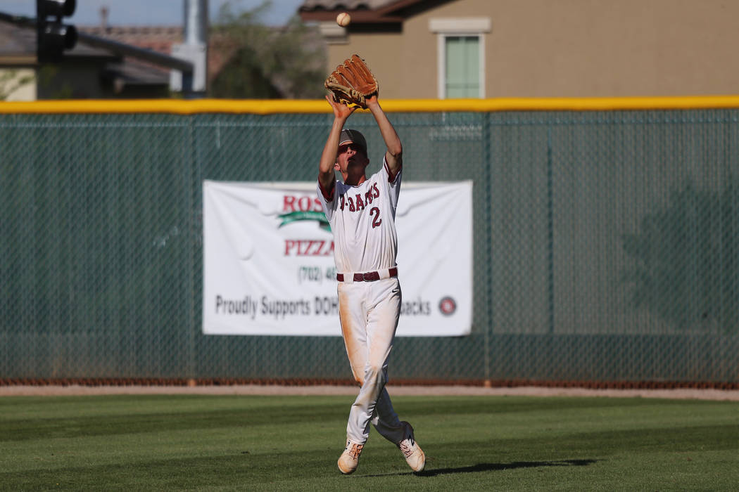 Desert Oasis' Jordan DeMarce (2) makes a catch for an out in the outfield against Basic in the ...