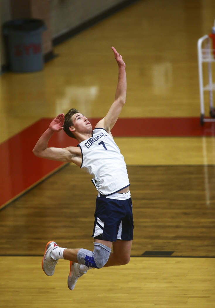Coronado's Jacob Ceci (7) goes up to serve the ball against Foothill during the Desert Region t ...