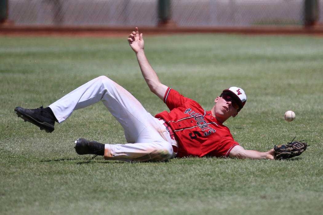 Las Vegas' Joel Lindahl (5) misses the ball in the outfield against Desert Oasis in the Souther ...