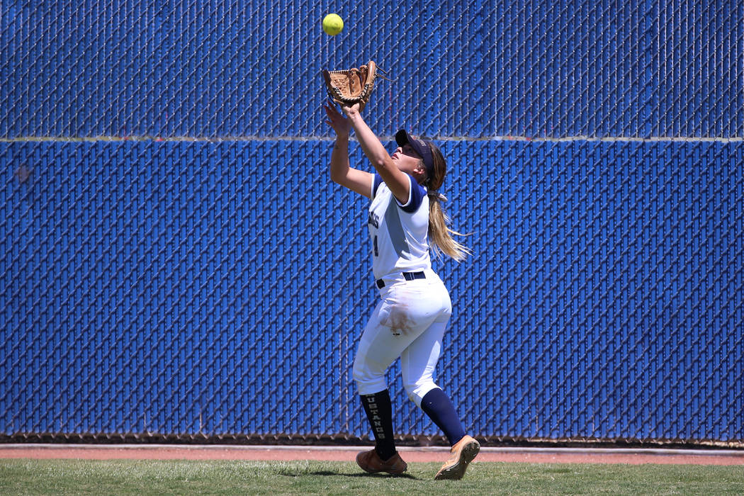 Shadow Ridge's Shea Clements (4) makes a catch in the outfield for an out against Coronado in t ...