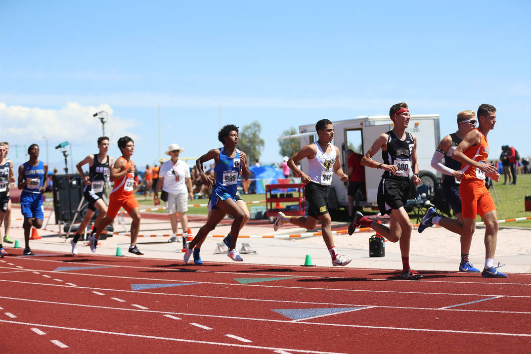 Runners compete in the Desert Region boys 3200 meter run at Desert Oasis High School in Las Veg ...