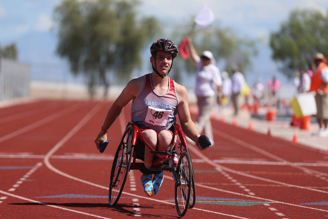 Arbor View's Blake Dickinson (46) competes in the Mountain Region boys 100 meter wheelchair das ...