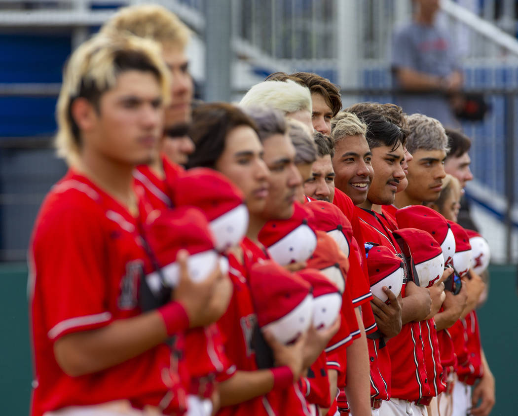 Las Vegas players stand for the National Anthem versus Reno during their state baseball tournam ...