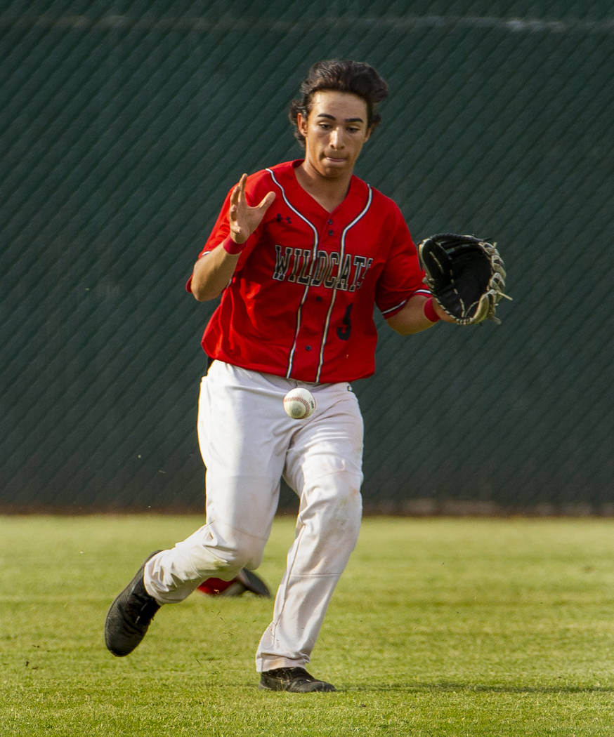 Las Vegas' Jose Martinez (9) eyes a short bounce in the outfield versus Reno during their state ...