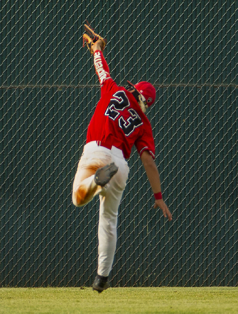 Las Vegas' Dalton Silet (23) extends in the air to catch a long, fly ball in the outfield versu ...