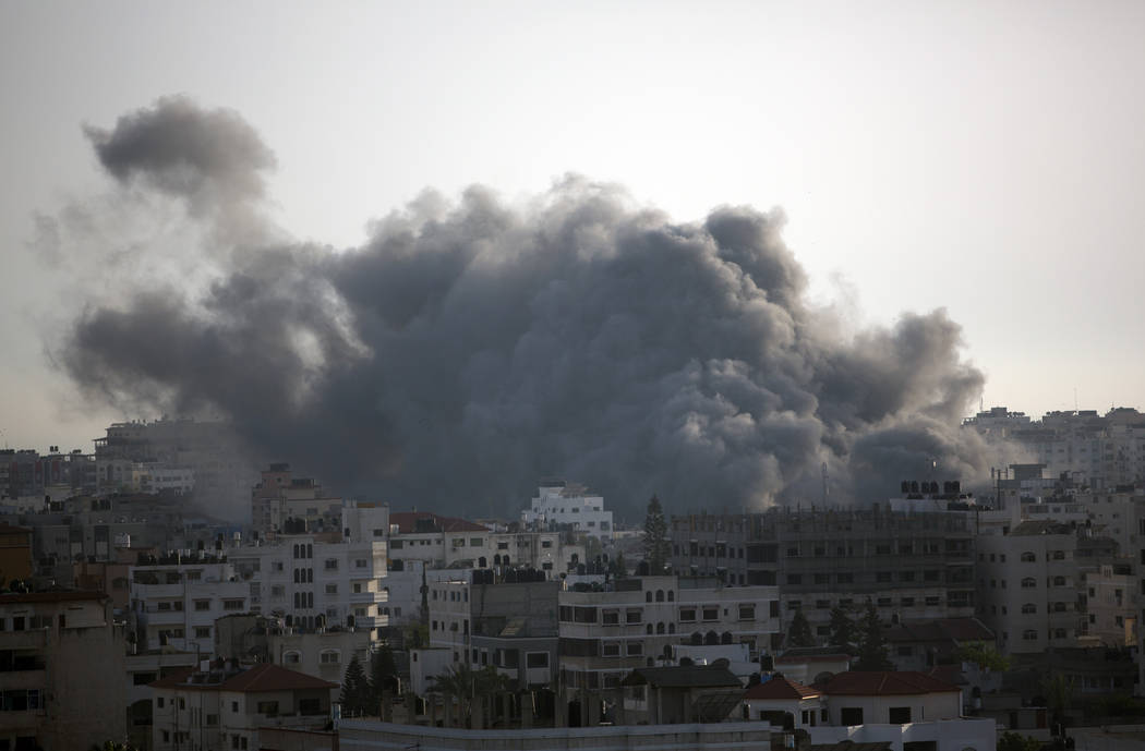 Black smoke caused by an Israeli airstrike in Gaza City, Sunday, May. 5, 2019. Palestinian mili ...