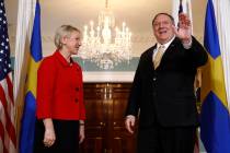 Secretary of State Mike Pompeo, right, waves as he stands alongside Swedish Foreign Minister Ma ...