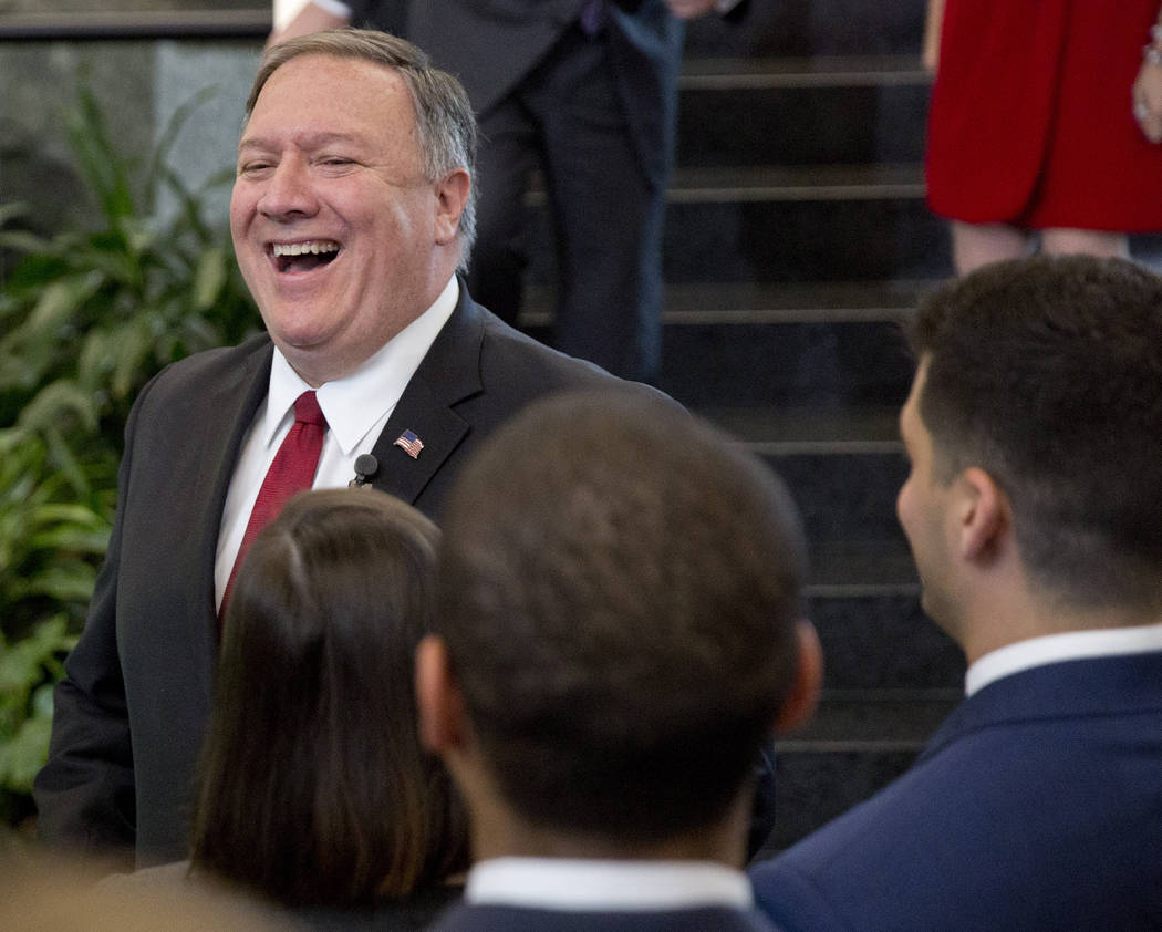 Secretary of State Mike Pompeo smiles while meeting employees after announcing a new 'ethos' st ...