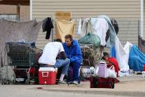 Gomeless people gather on the sidewalk at an encampment in Phoenix on May 2, 2019. (AP Photo/Ro ...