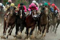 Flavien Prat on Country House, left, races against Luis Saez on Maximum Security, third from le ...