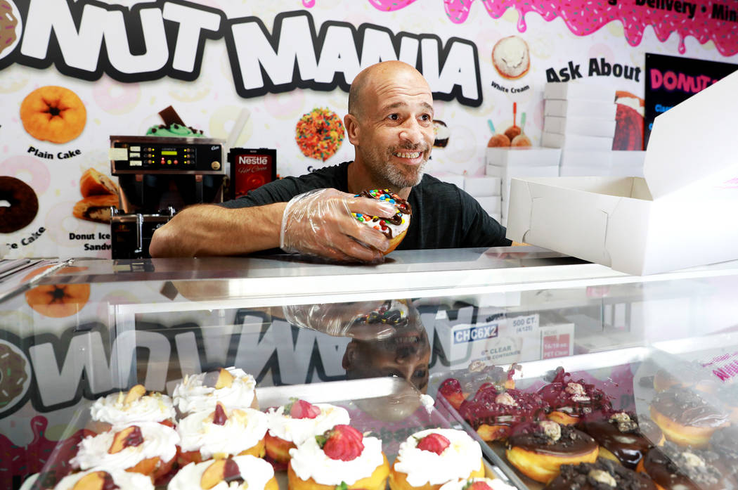 Brett Raymer, a star of the TV show "Tanked" and owner of Donut Mania, at his shop in Las Vegas ...