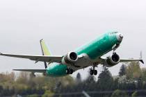 A Boeing 737 Max 8 airplane being built for India-based Jet Airways, takes off April 10, 2019, ...