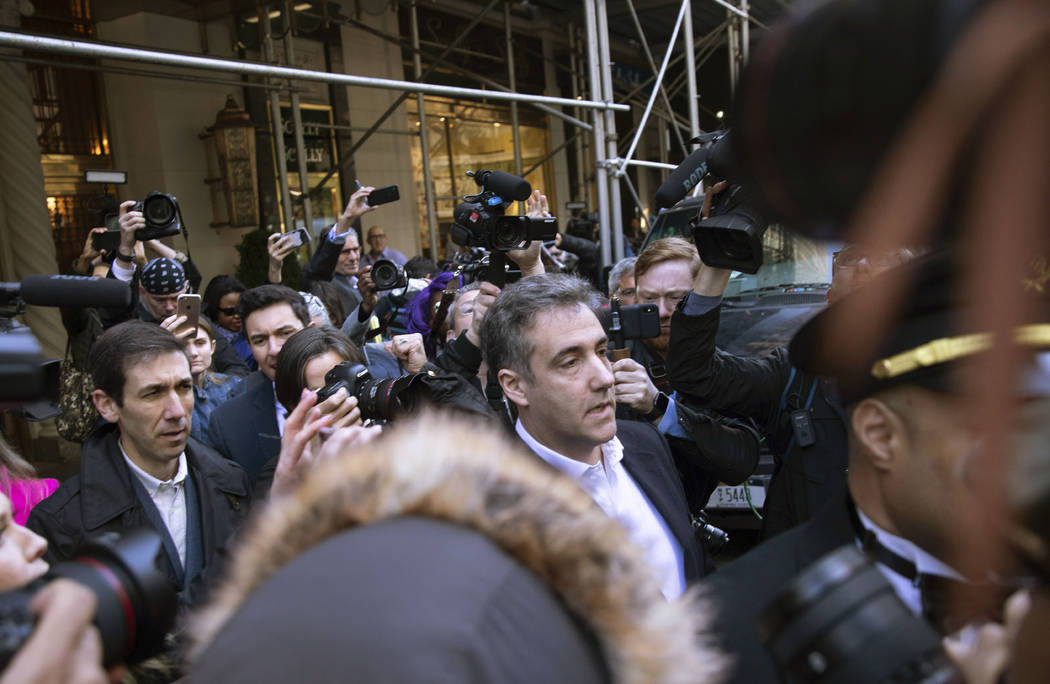 Michael Cohen, former attorney to President Donald Trump, leaves his apartment building before ...