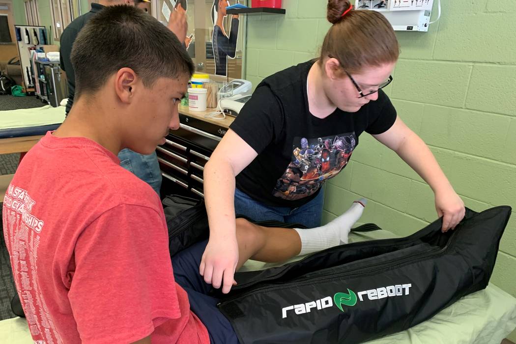 Students in Jeffrey Taormina's peer sports medicine class treat student athletes to gain hands- ...