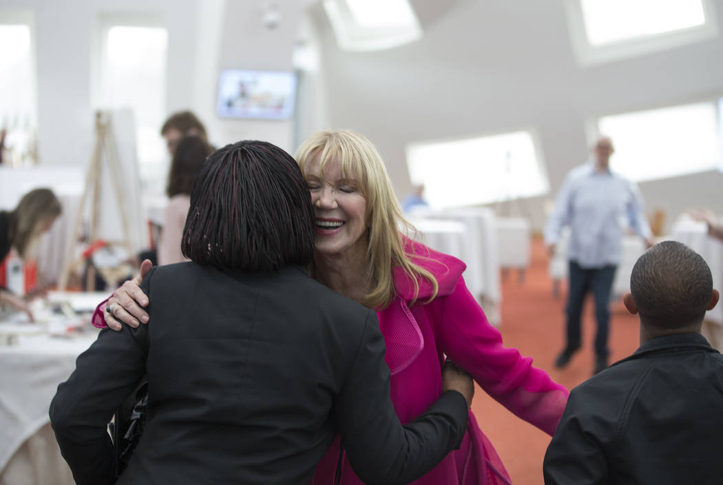 Linda Smith, middle, former chief fundraiser for Opportunity Village and author of a memoir abo ...