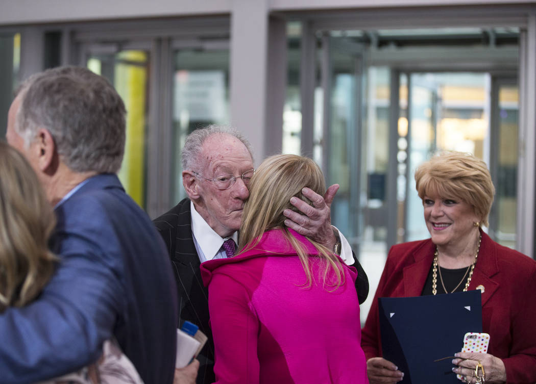 Former Las Vegas Mayor Oscar Goodman, left, and current Mayor Carolyn Goodman, greet author Lin ...