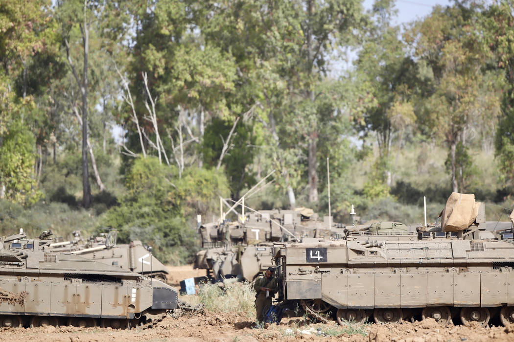 An Israeli soldier stands at a gathering point in Israel Gaza Border, Monday, May 6, 2019. The ...