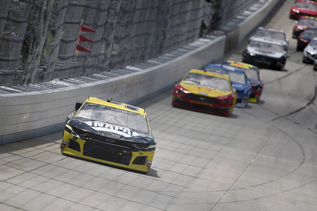 Driver Chase Elliott (9) leads driver Joey Logano (22) during the NASCAR Cup Series auto race, ...