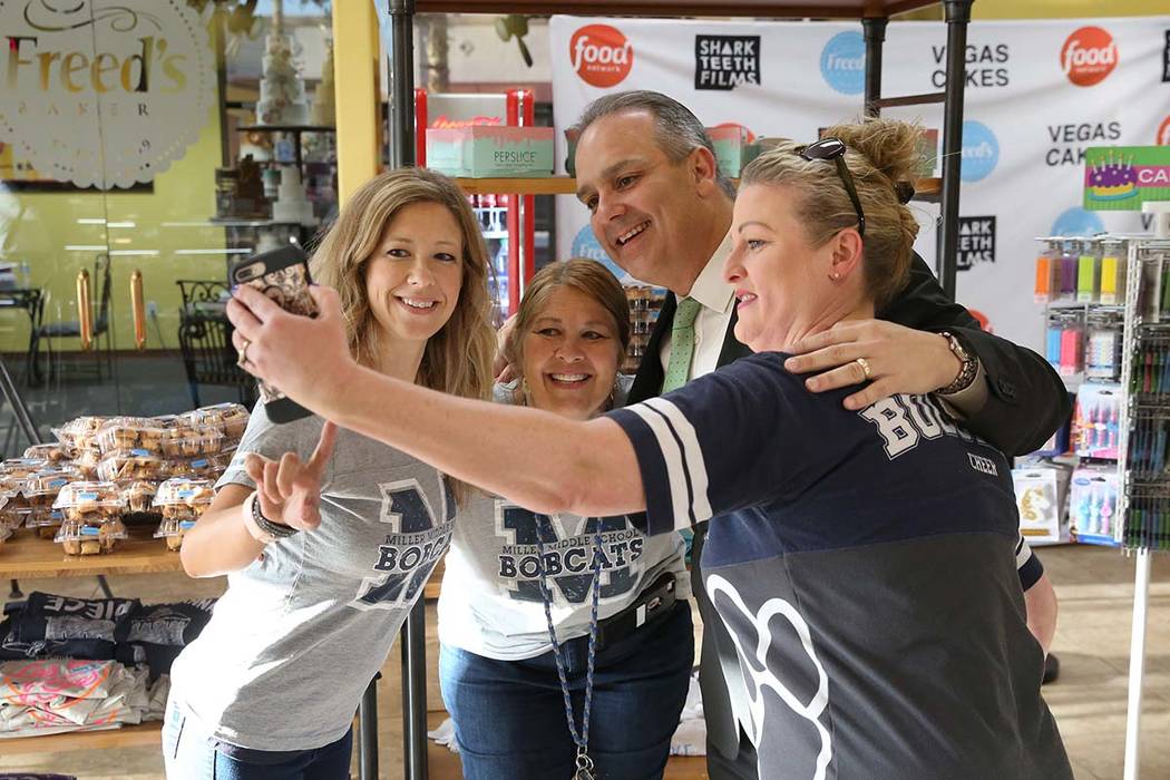 Clark County School Superintendent Jesus F. Jara, second right, poses for a selfie with Bob Mil ...