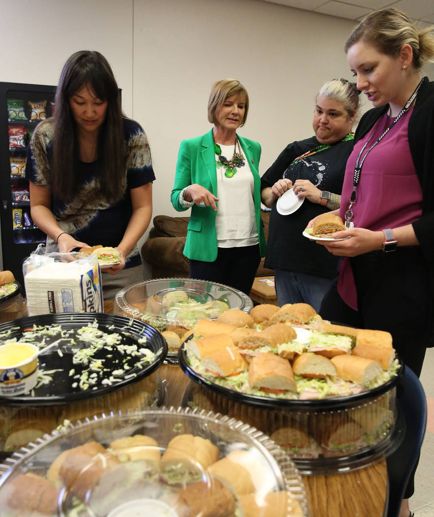 Rep. Susie Lee, D-Nev., second left, chats with special education teachers Kirsten Young, right ...