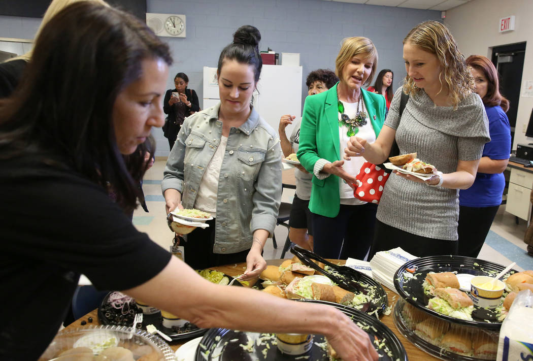 Rep. Susie Lee, D-Nev., second right, chats with english teacher Laura Ciaramitaro, right, afte ...