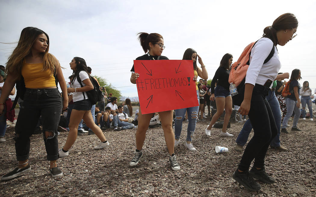 Quiriat Rosas, 17, center with sign, and other students dance to Mexican music after marching f ...