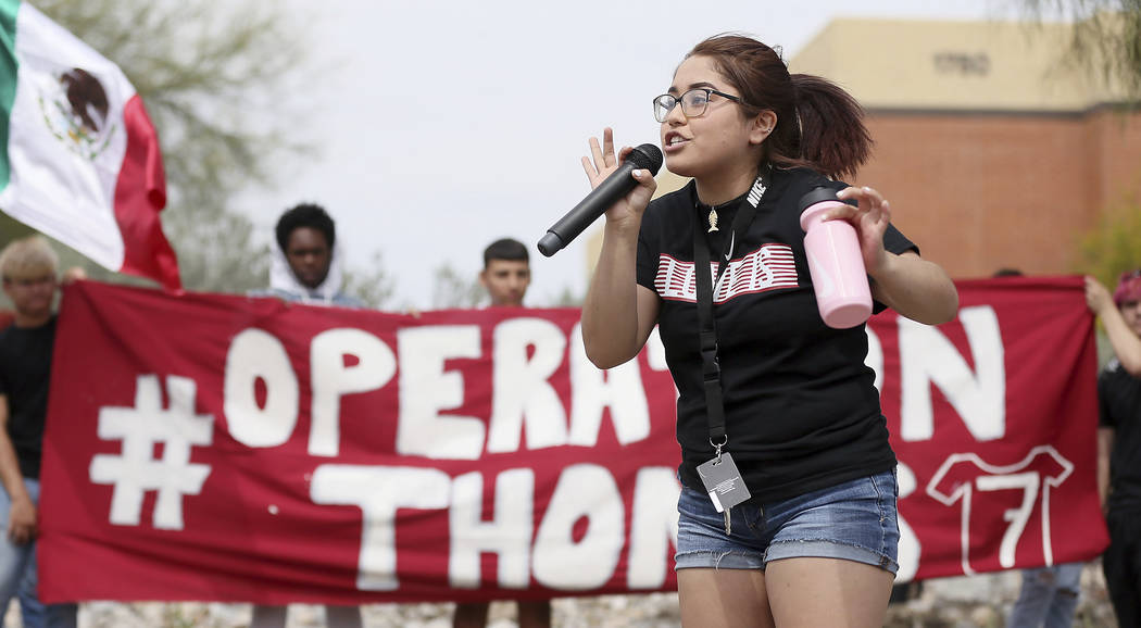 Quiriat Rosas, 17, speaks to the crowd after students from Desert View High School marched to t ...