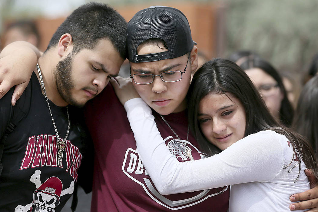 From left to right, Marcell Ibarra, 18, Daffne Anselmo, 16, and Jamilet Fragoso, 16, comfort ea ...