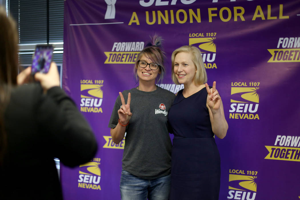 Democratic presidential candidate Sen. Kirsten Gillibrand takes a photo with Darla Garcia after ...