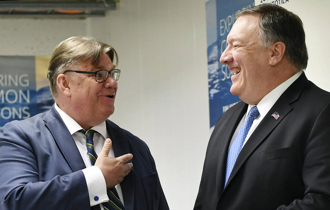 U.S. Secretary of State Mike Pompeo, right, chats with Finland's Foreign Minister Timo Soini ah ...