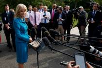 White House counselor Kellyanne Conway talks with reporters outside the White House, Tuesday, A ...