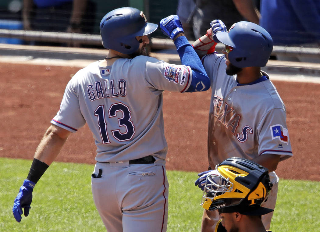 Texas Rangers' Joey Gallo (13) celebrates with Elvis Andrus after hitting a two-run home run of ...