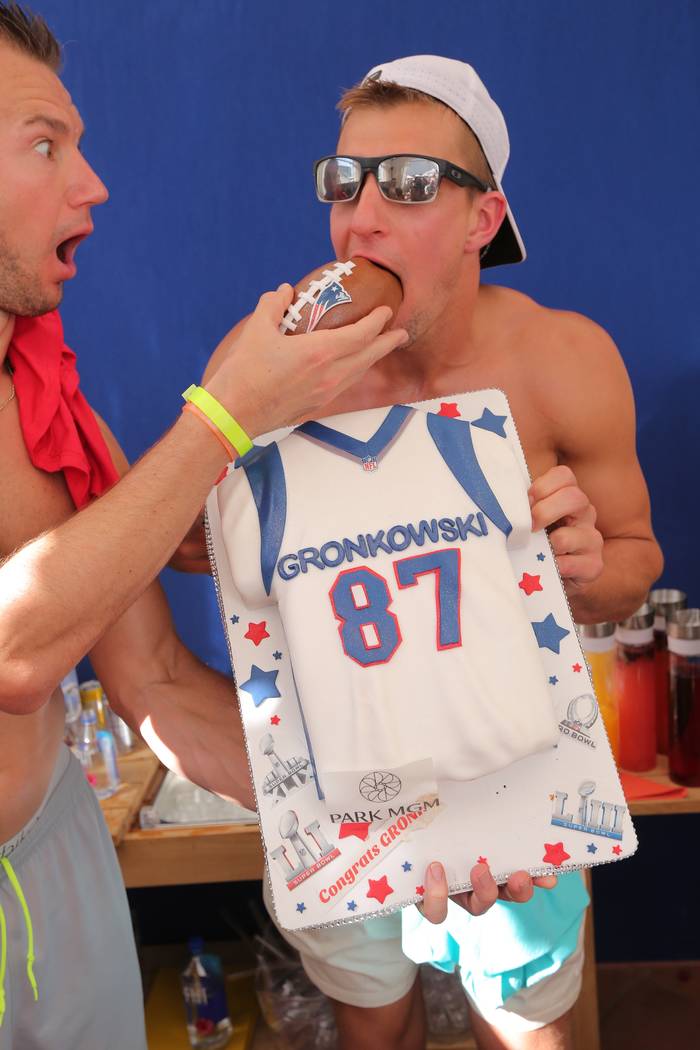 Ex-New England Patriots tight end Rob Gronkowski devours a celebratory retirement cake at Jemma ...