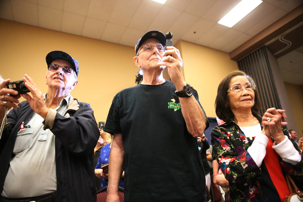 Supporters listen to Democratic presidential candidate Joe Biden speak during a campaign stop a ...