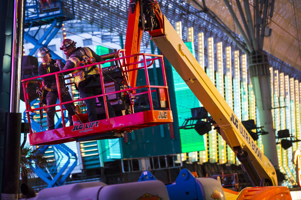 Construction use a lift during the second day of renovations of the Viva Vision canopy along th ...