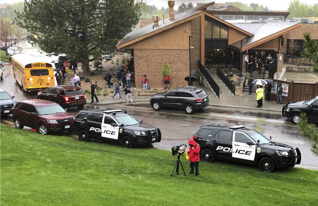 Police and others are seen outside STEM School Highlands Ranch, a charter middle school in the ...